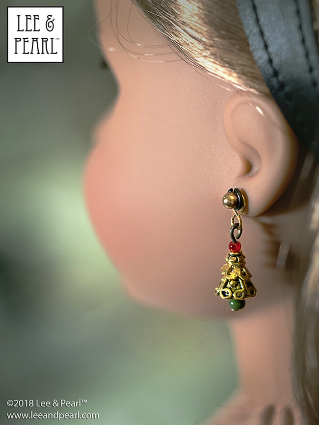 It's Day Four of Lee & Pearl Cyber Week, and we have lots of doll treats for you — a round-up of all our previous Christmas and Chanukah holiday crafts, like these beautiful filigree Christmas Tree earrings for dolls.