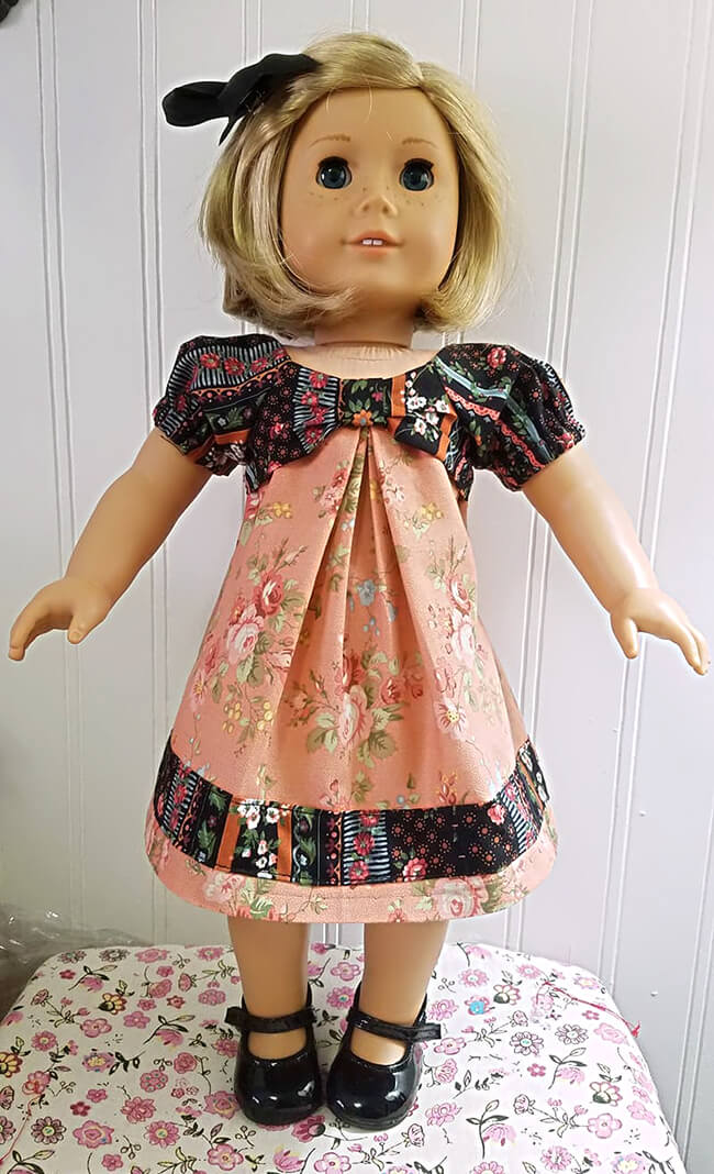 Our FREE GIFT to Lee & Pearl mailing list subscribers — Pattern 1038: The Gift Bow Front Dress for 18 Inch American Girl, 16 Inch A Girl for All Time and 14 1/2 Inch Wellie Wisher and similar dolls. Click to sign up! Diana R.S. made a bold design choice for her American Girl doll's dress. We love that added band of striped yoke fabric embellishing the bottom of her skirt.