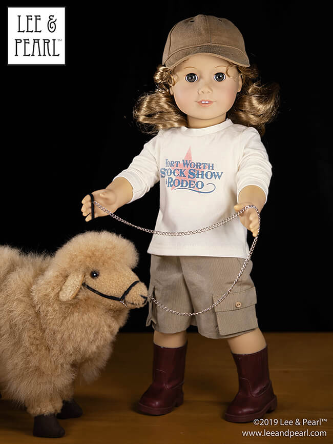 Our American Girl doll is ready for the 4H sheep showing ring wearing a casual ranch outfit made using Lee & Pearl Pattern 1001: Unisex T-shirts, Pattern 1008: Classic Ball Cap and Big Fat Trucker Hat, and Pattern 1004: Boy Style Pants and Cargo Shorts for 18 Inch Dolls.