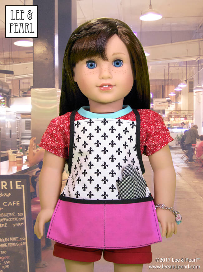 Who else is mesmerized by the Great British Baking Show this Christmas? Today, we're presenting baking-themed patterns for dolls, perfect for gifts, holiday scenes, sewing along to your favorite new TV show — and for Blaire Wilson, the COMING SOON 2019 American Girl Girl of the Year! Here’s Pattern 1033: Bonjour, Paris Top, Dress, Shorts and Chef’s Apron for 18 Inch Dolls, available in the Lee & Pearl Etsy store at https://www.etsy.com/listing/267357348/lp-1033-bonjour-paris-wardrobe-pattern