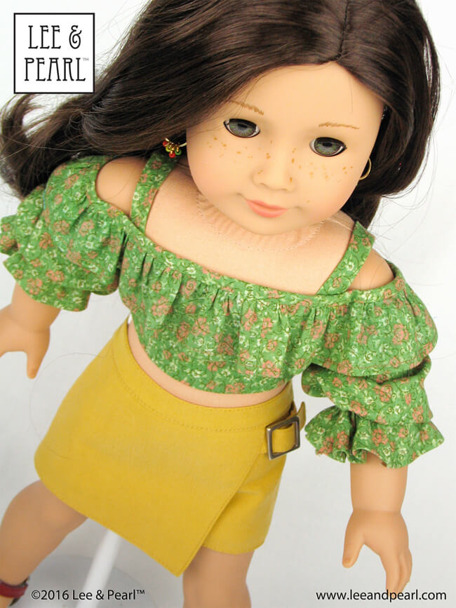 Make flattering summer tops and tropical dresses for 18 inch American Girl dolls, 16 inch A Girl for All Time dolls or 14 1/2 inch Wellie Wisher or similar play dolls using the NEW multi-sized Lee & Pearl Pattern 1035: Olá Brasil! Off-the-Shoulder Samba Top, Bahia Dress and Traditional Brazilian Baiana Headwrap. Find this unique and lovely pattern in the Lee & Pearl Etsy store!