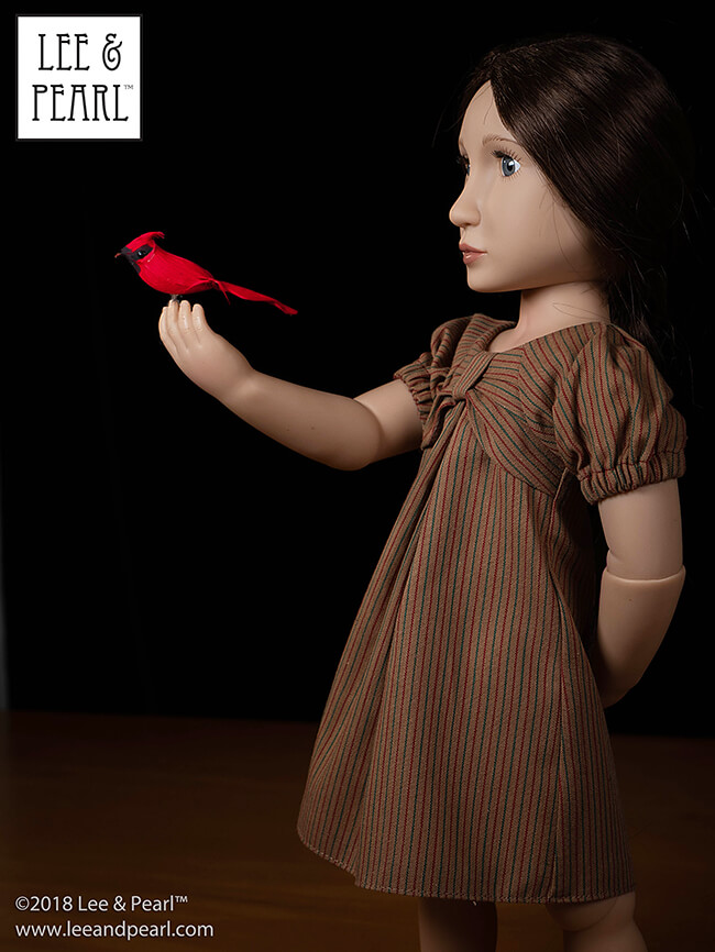 Meet the Dollmaker — Lee & Pearl interview Frances Cain, the creator of the A Girl for All Time® line of historical and modern 16 inch play dolls | Photo: A Girl for All Time Matilda wears an outfit made using Lee & Pearl Pattern 1038: The Gift Bow Front Dress, our exclusive FREE doll pattern for mailing list subscribers in 2019.