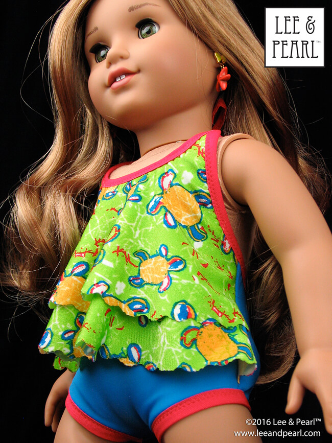Our Lea Clark loves her sea turtle swimsuit! We made this darling draped-front swimsuit for our American Girl doll using Lee & Pearl Pattern 1057: Halter Swimsuit with Tiered Drape and Halter Swimdress for 18 Inch Dolls — and the LIMITED EDITION Sea Turtles In Paradise Fabric and Fold Over Elastic and Trim Kit. Lee & Pearl patterns and fabric and trim kits are available in our Etsy store at https://www.etsy.com/shop/leeandpearl