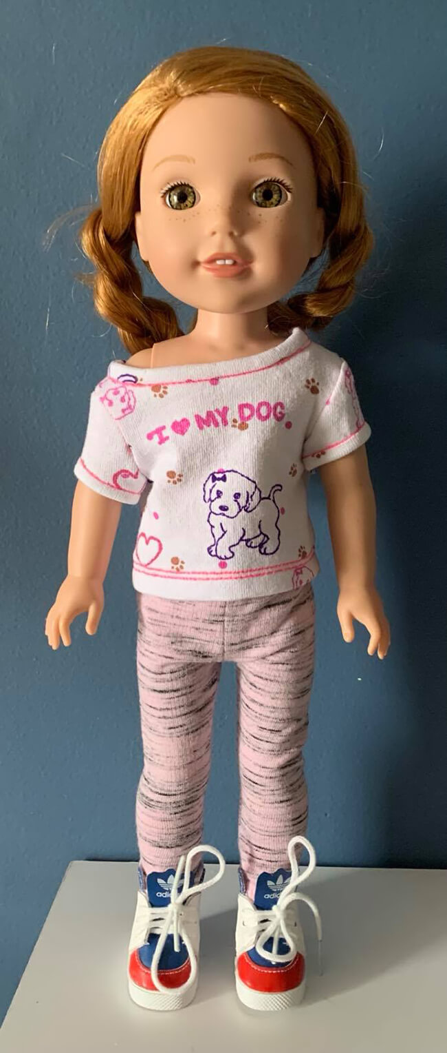 Look who's making L&P Pattern 1983: She's a Maniac Workout T-Shirt for Dolls... At the end of the design process, we send a draft pattern to our crack team of testers, and it's always a joy to see what they come up with. Join as we share inspirational images of so many different interpretations of our adorable, adaptable pattern -- like this adorable WellieWishers shirt by Linda C.