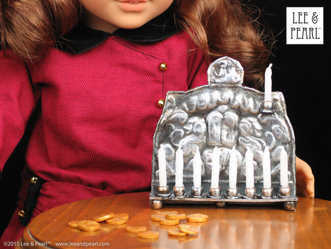 Happy Chanukah from Lee & Pearl! Make your 18 inch doll, like our American Girl® Rebecca Rubin, her very own pressed metal Chanukah Menorah (Chanukiya) using a dollar store cookie sheet, cardboard, glue, plastic beads, a knitting needle, metallic paints and the techniques in our easy VIDEO TUTORIAL.
